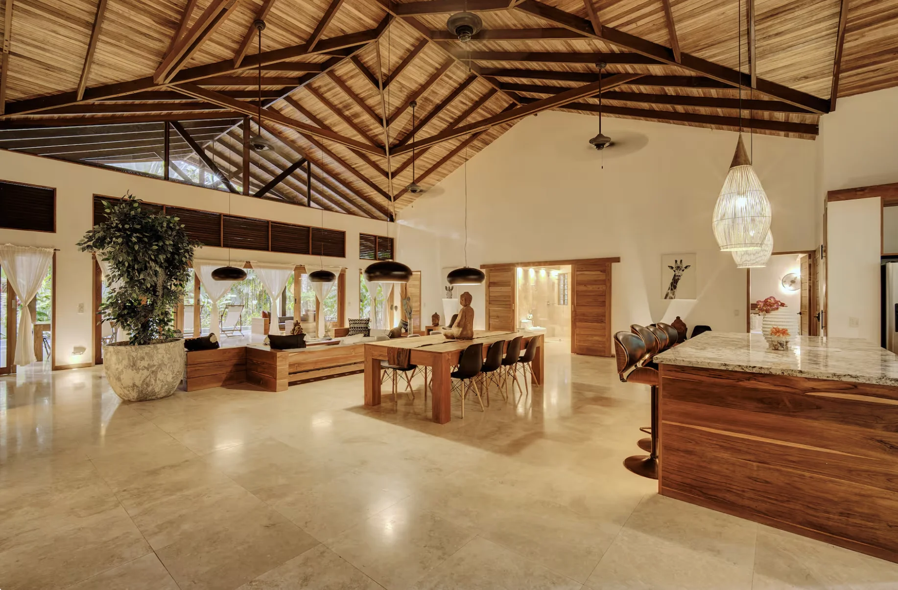 Tropical villa dining hall under a wooden bamboo roof