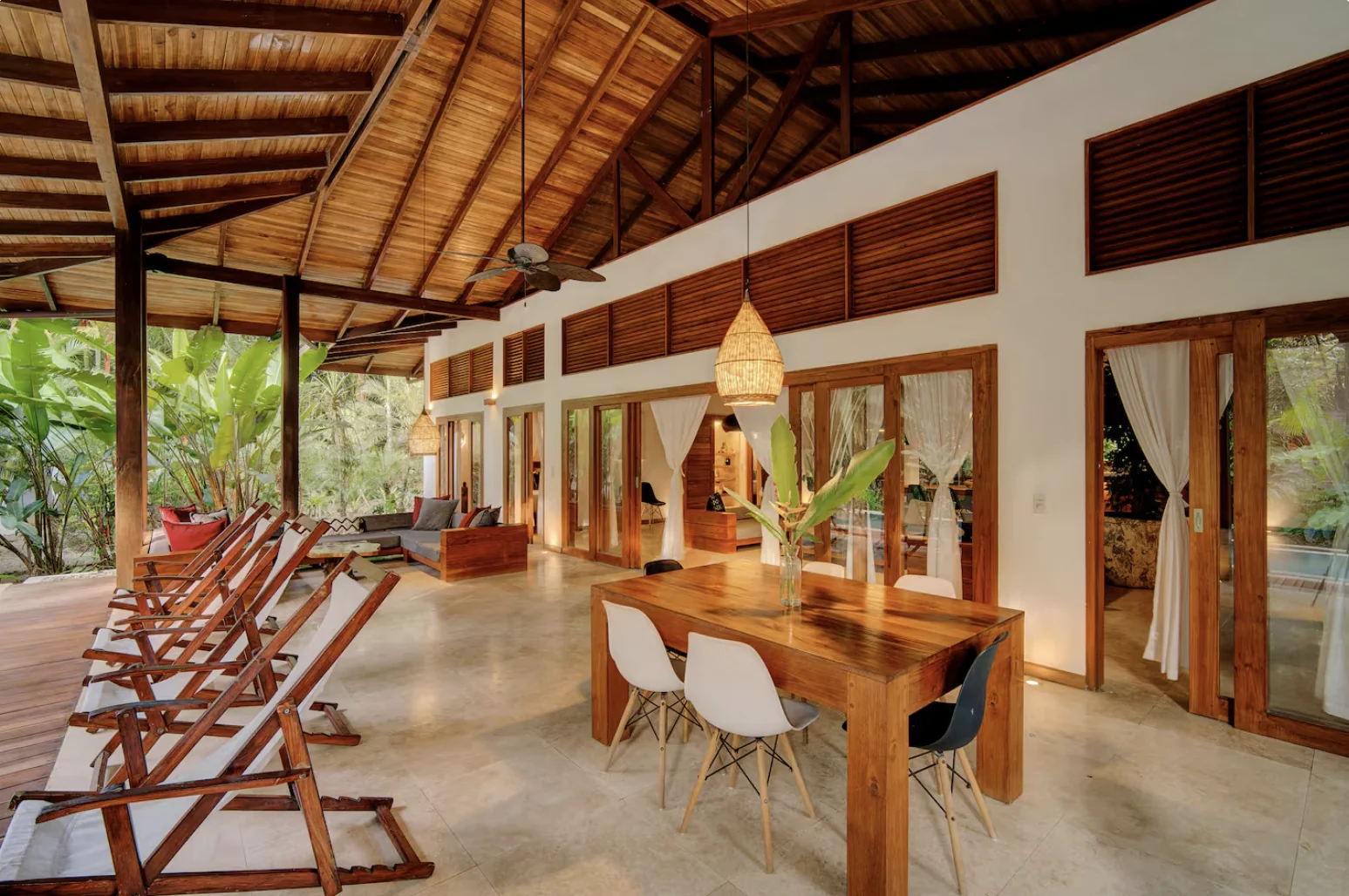 Main villa terrace with sun loungers and jungle view